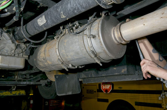 Mechanic inspecting diesel particulate filter