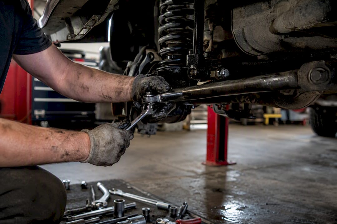 Mechanic installing heavy duty tie rod